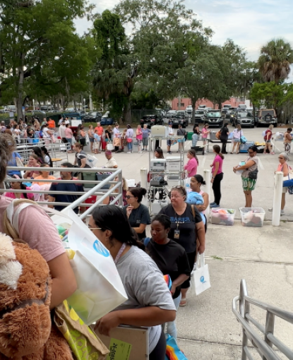 Teachers waiting to collect supplies at annual event with United Way of Lee, Hendry & Glades and Foundation for Lee County Schools