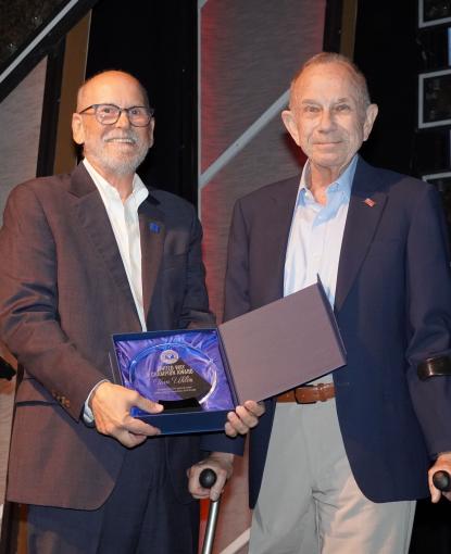 Steve Pontius presents Tom Uhler with United Way of Lee, Hendry & Glades Lifetime Champion Award